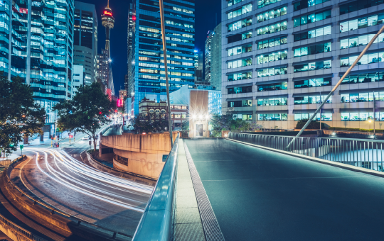 buildings with a bridge with car lights