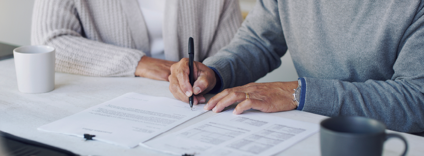 Couple signing a document